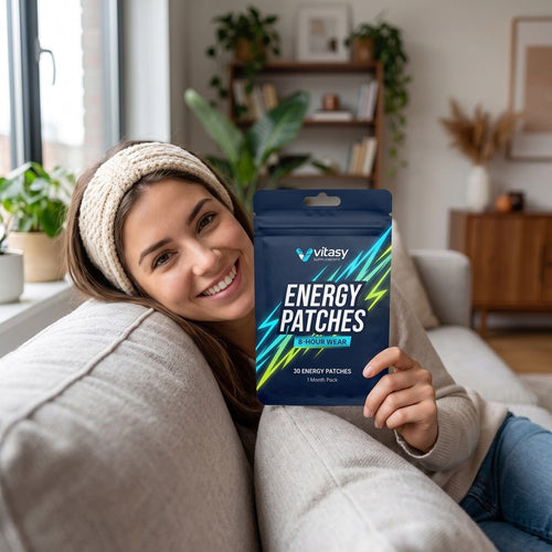 Woman holding a Vitasy Energy Patches pouch at home