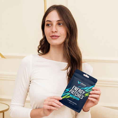 Woman holding a pouch of Vitasy Energy Patches
