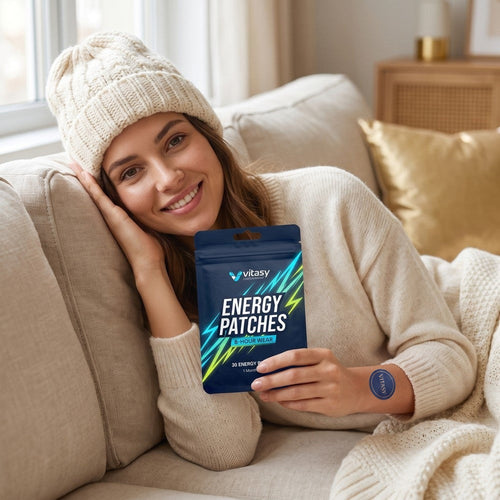 Woman relaxing at home with a pouch of Vitasy Energy Patches