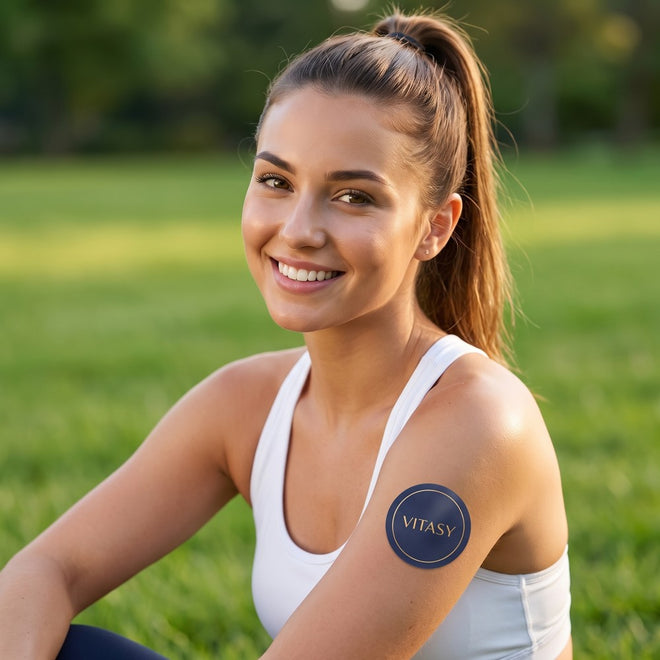 Woman outdoors wearing a Vitasy patch on her shoulder