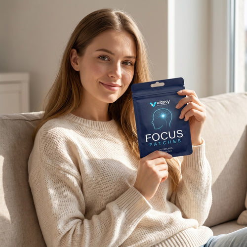 Woman holding a Vitasy Focus Patches pouch at home