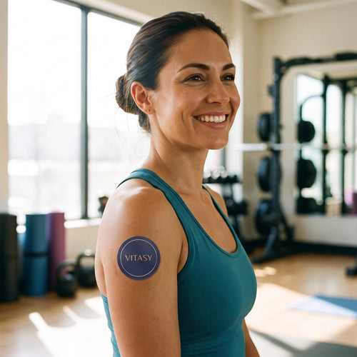Woman at the gym with a Vitasy patch on her upper arm