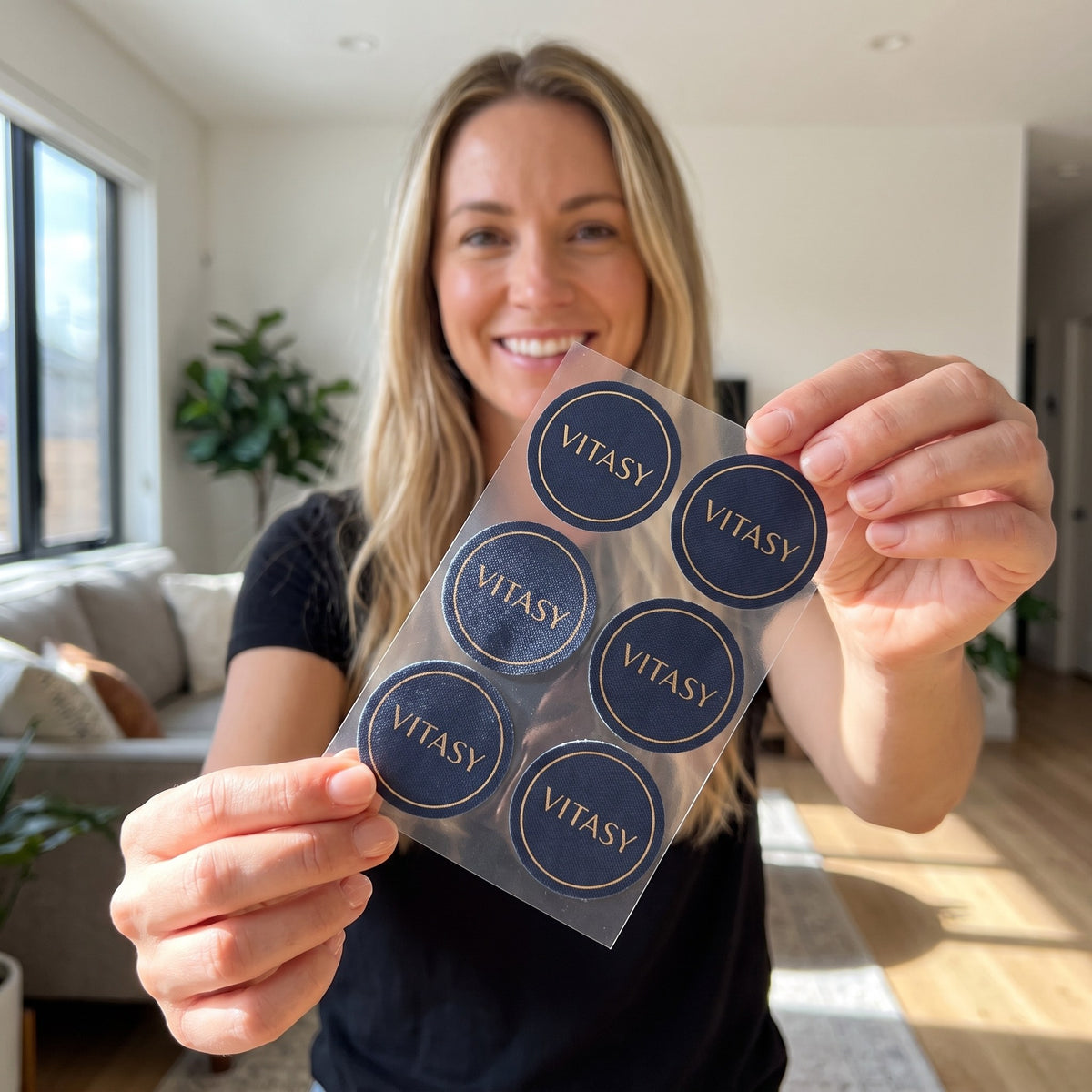 Woman holding a sheet of Vitasy patches