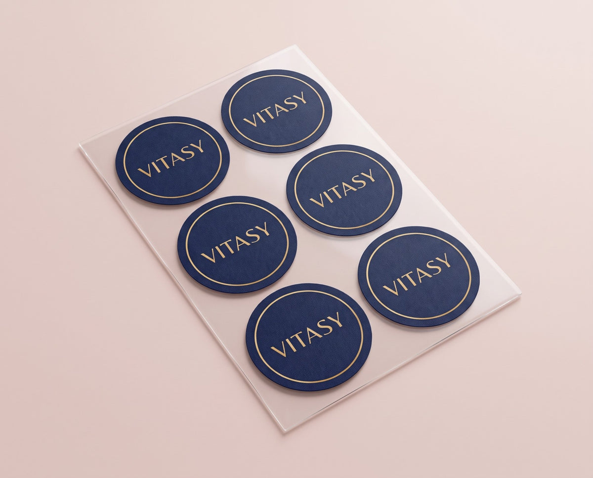 Sheet of six navy Vitasy patches with a gold ring