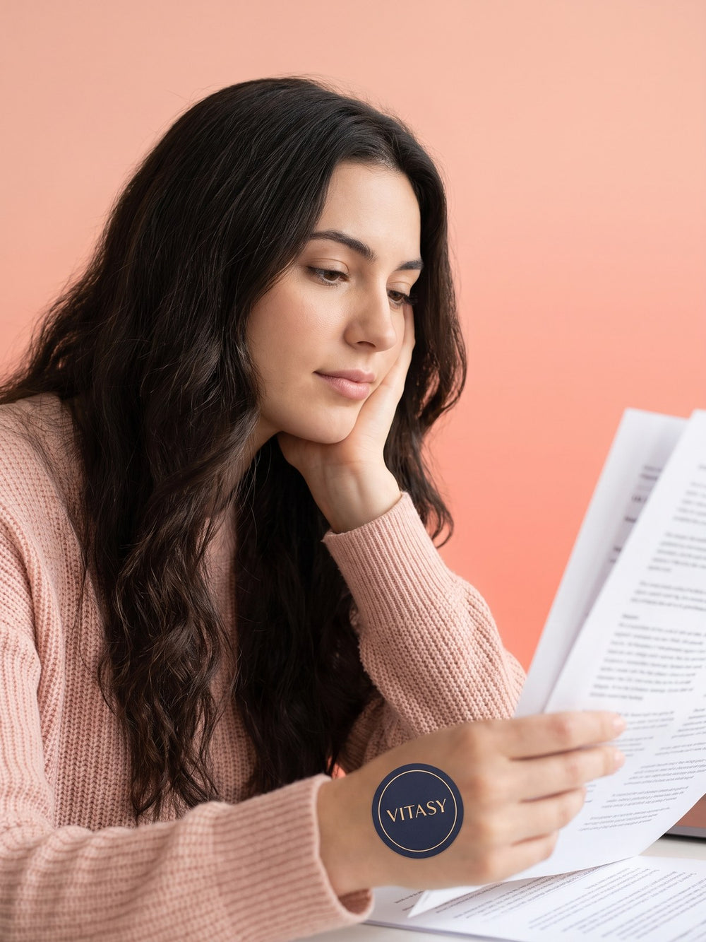 Woman reading her notes at a table