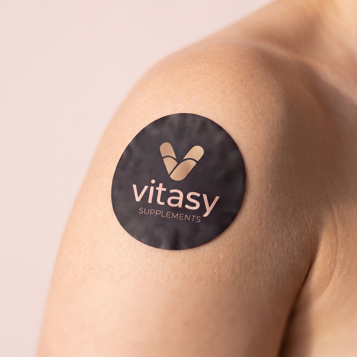 Vitasy patch on the shoulder