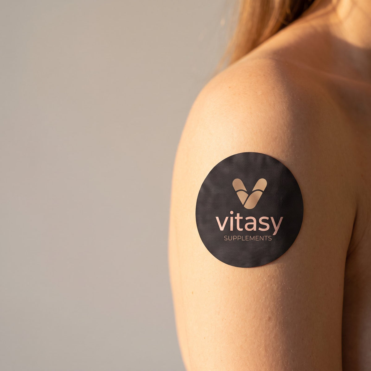 Vitasy patch on the upper arm