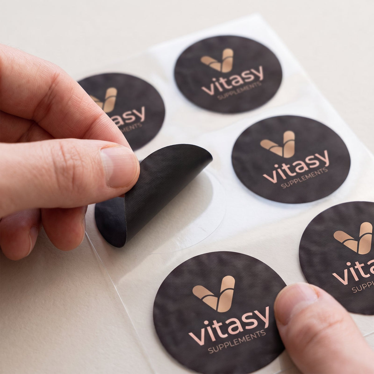 Peeling a Vitasy patch from the backing sheet