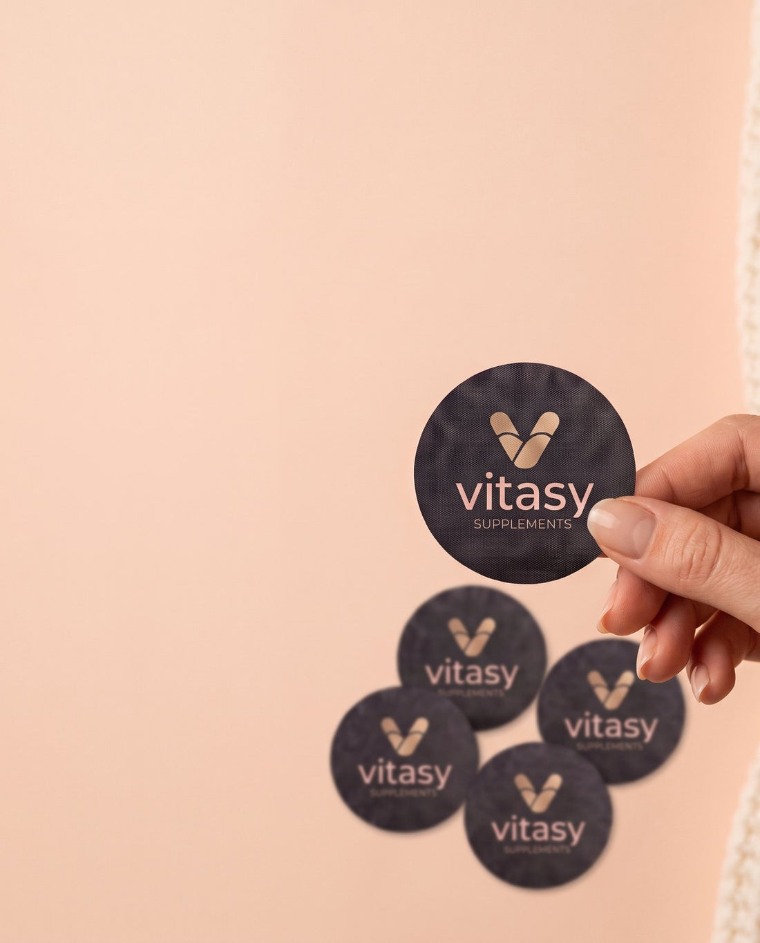 Hand holding a Vitasy patch