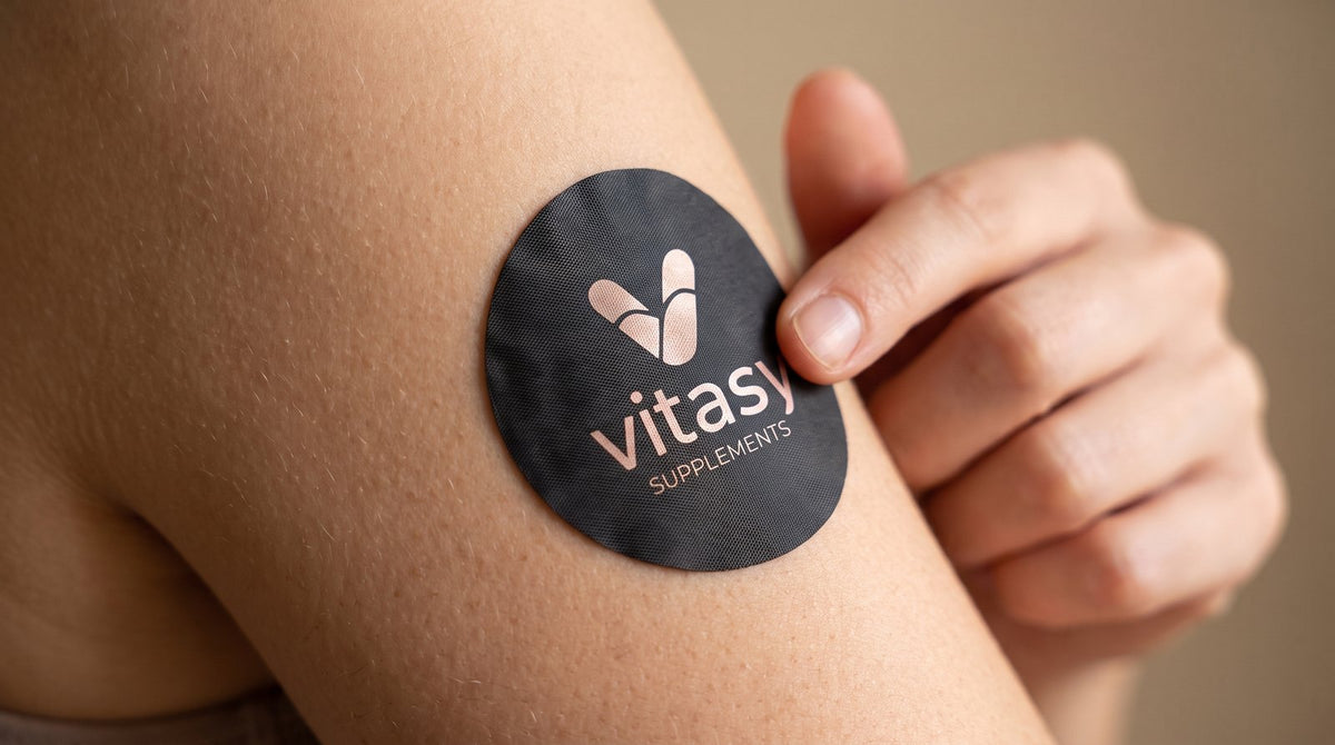 Applying a Vitasy patch to the upper arm