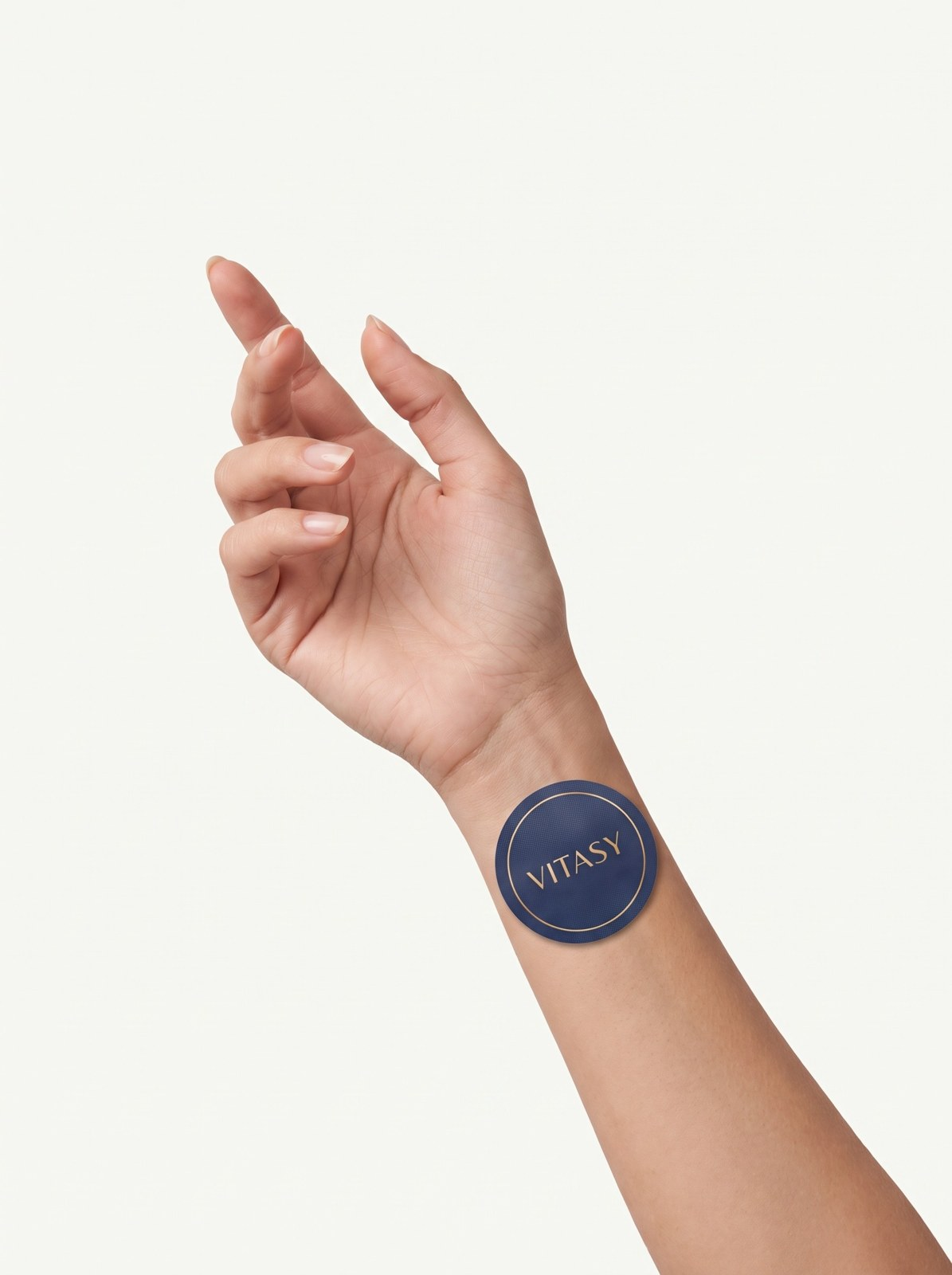 Hand with a Vitasy patch applied to the wrist