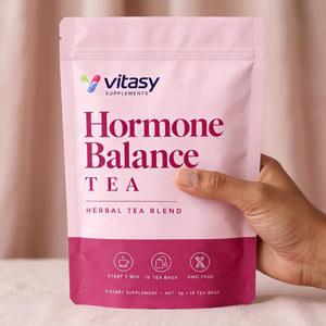 Hand holding the Vitasy Hormone Balance Tea pouch