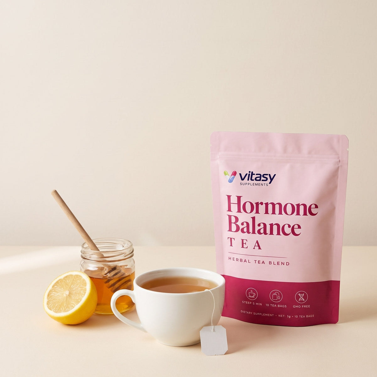 Cup of herbal tea with a tea bag, honey and lemon