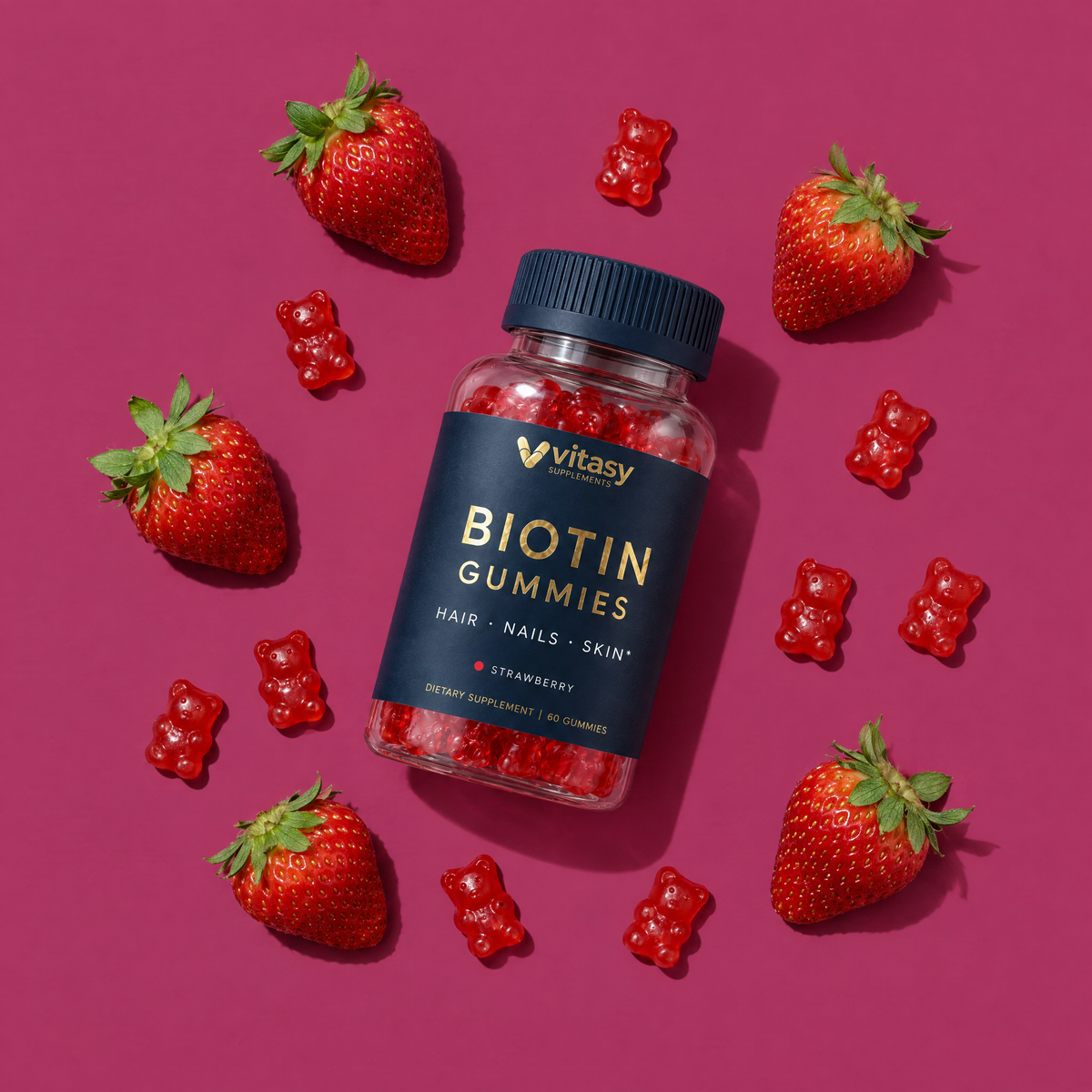 Vitasy Biotin Gummies Strawberry flat lay with fresh strawberries and gummy bears
