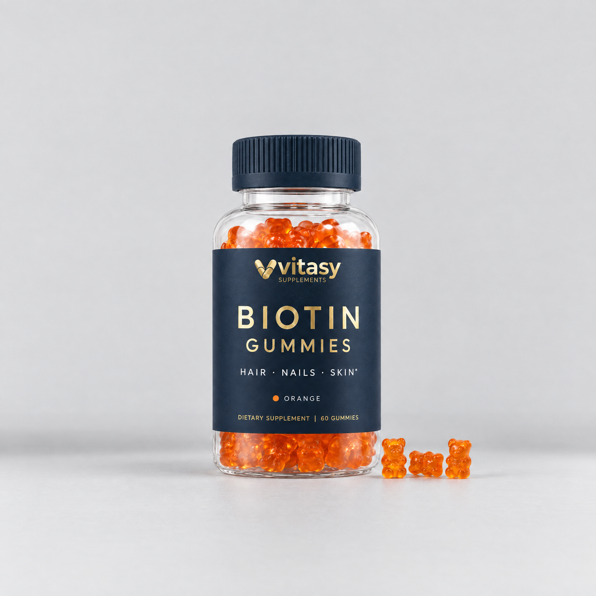 Vitasy Biotin Gummies Orange, navy bottle with gold foil label, 60 gummies