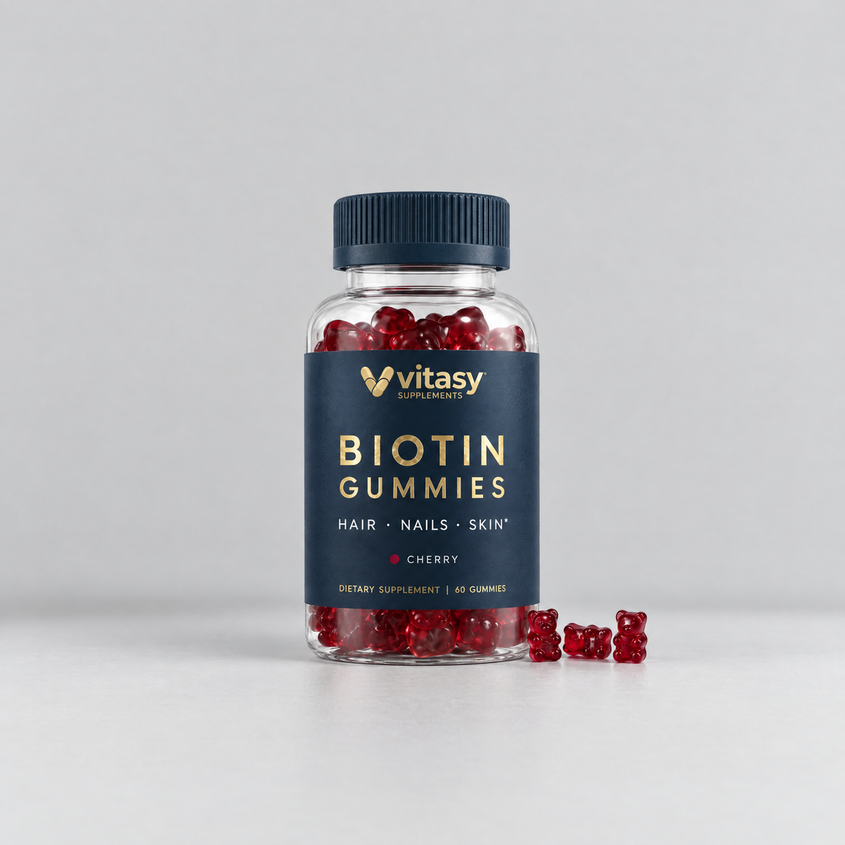 Vitasy Biotin Gummies Cherry, navy bottle with gold foil label, 60 gummies