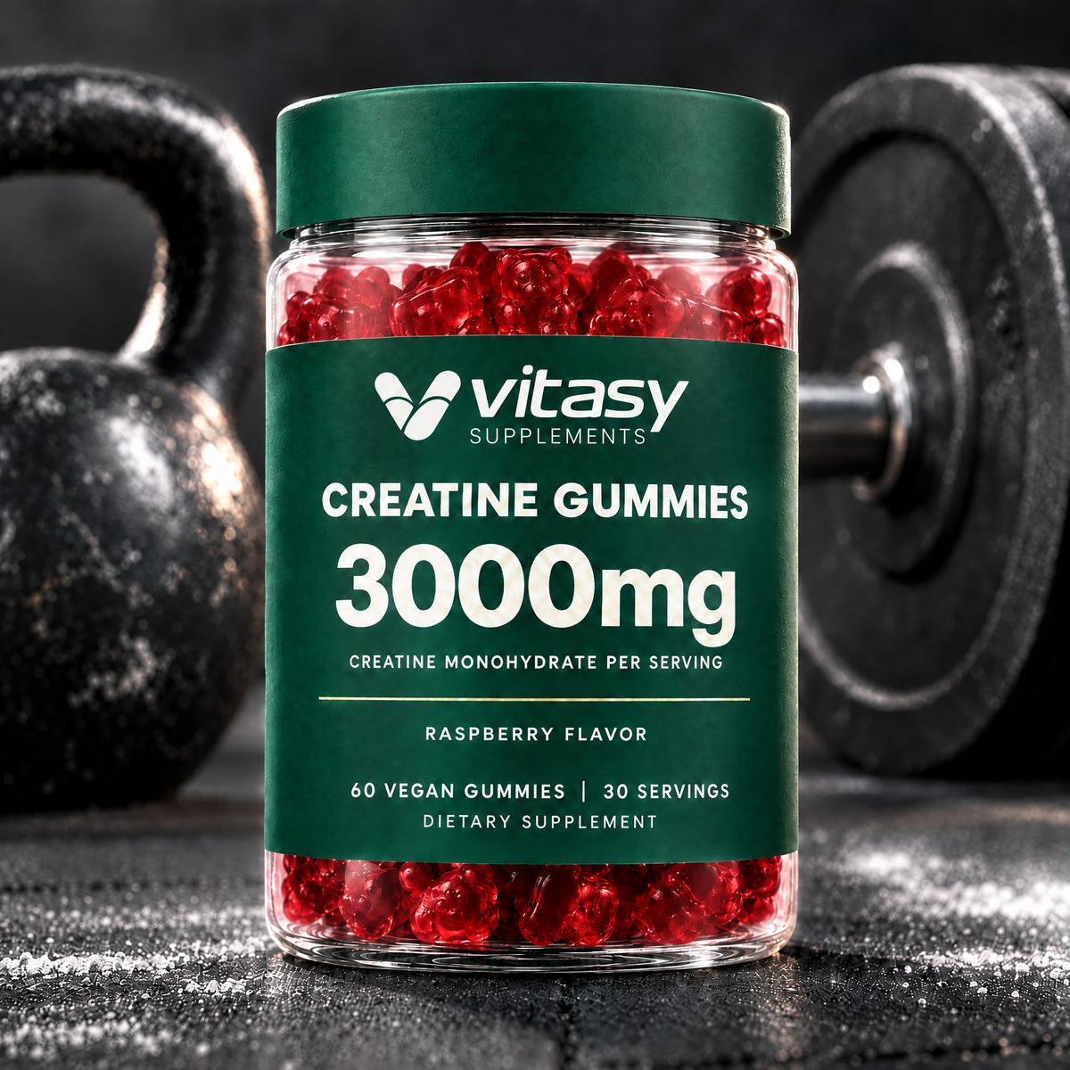 Raspberry Vitasy Creatine Gummies jar on a gym floor with a kettlebell and weight plate