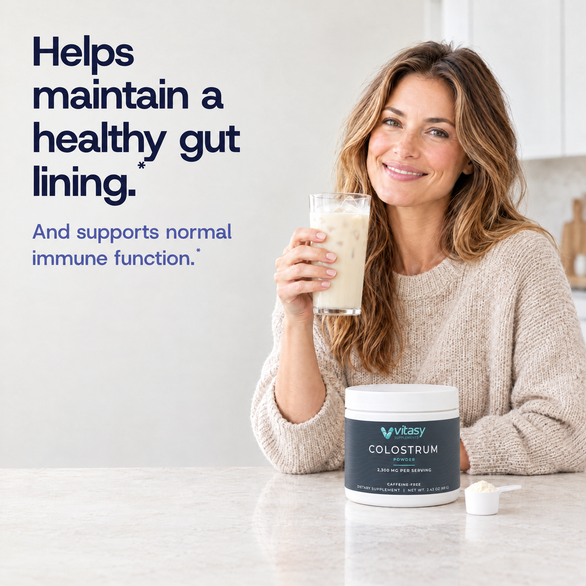Helps maintain a healthy gut lining. Woman holding a cold colostrum drink next to the tub