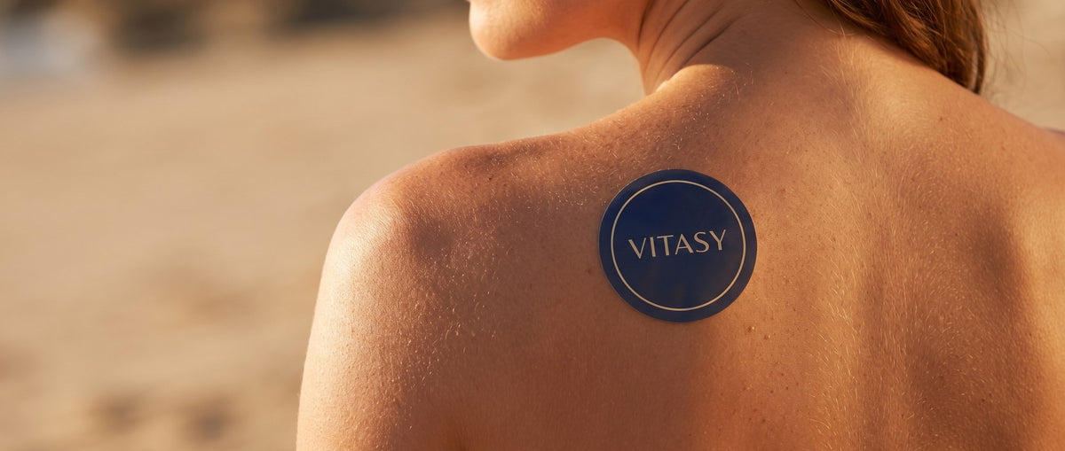 Vitasy patch on a shoulder