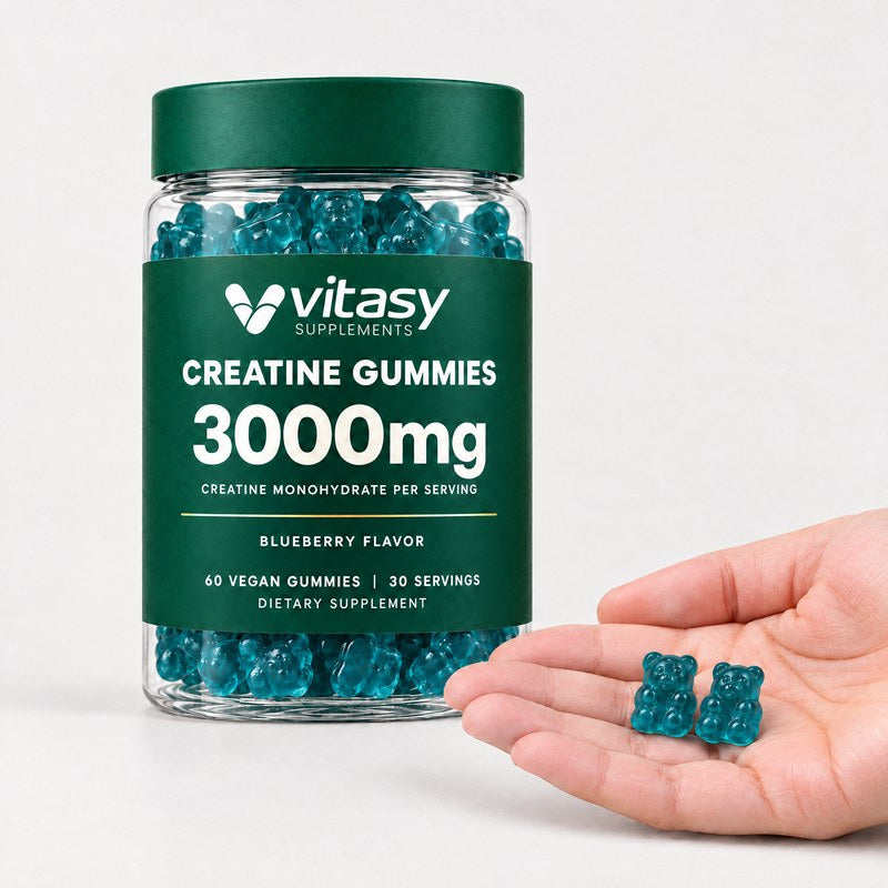 Two creatine gummies in a hand next to the Vitasy jar