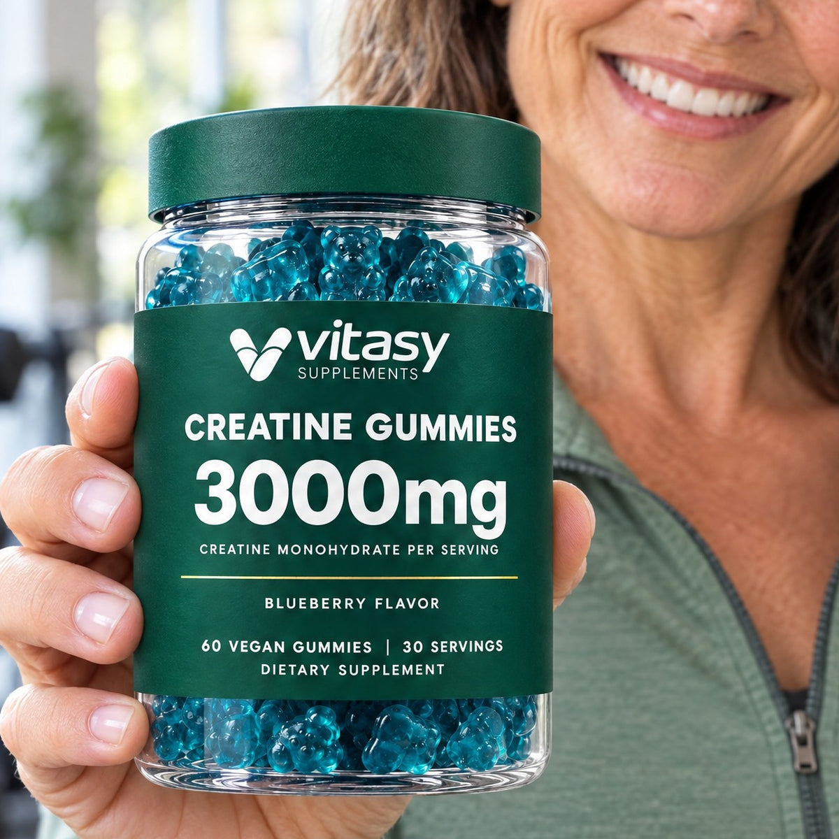 Woman holding a jar of Vitasy Creatine Gummies, 3000mg creatine monohydrate per serving