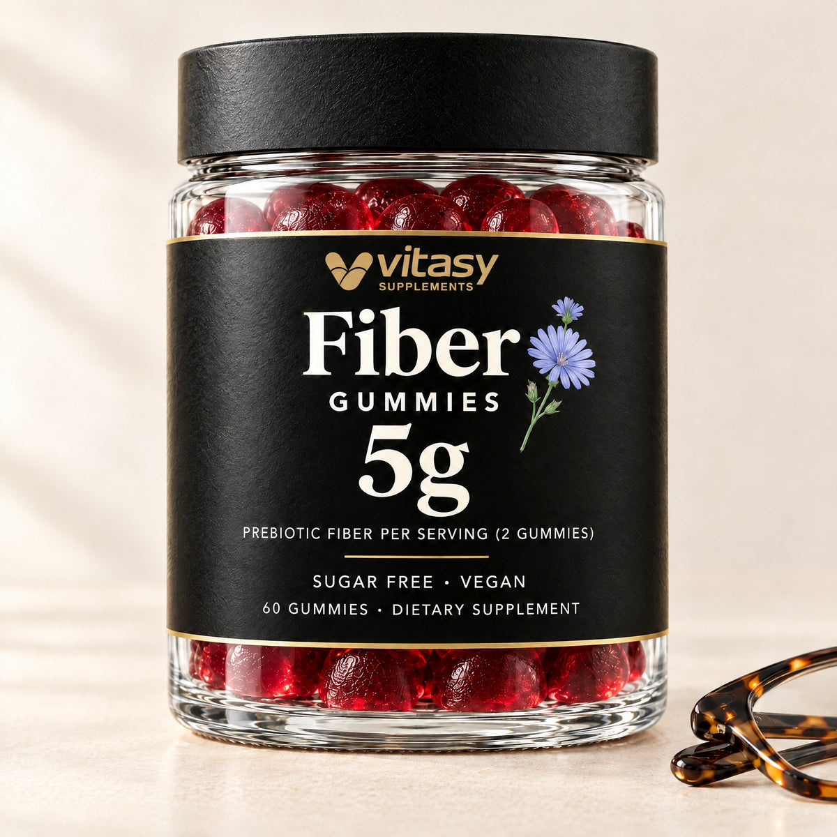 Vitasy Fiber Gummies jar with folded reading glasses