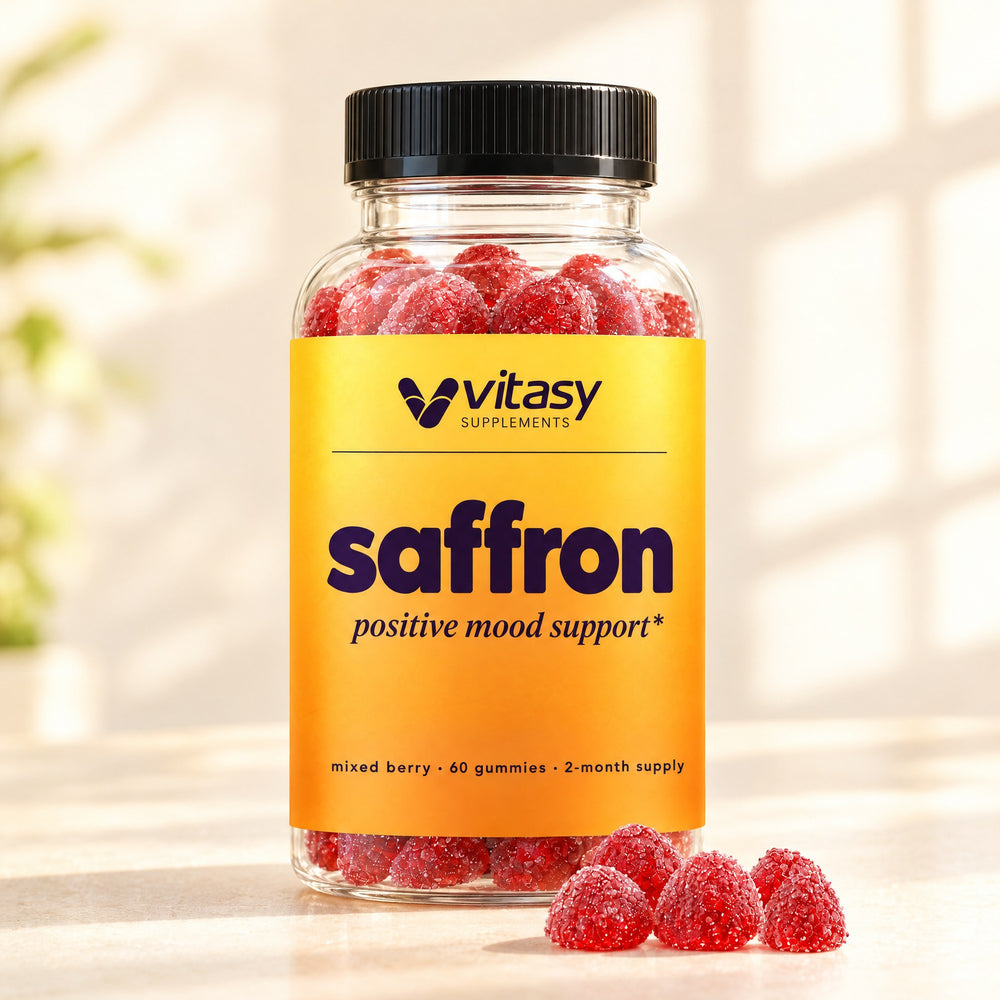 Vitasy Saffron Gummies bottle in morning light with red mixed berry gummies