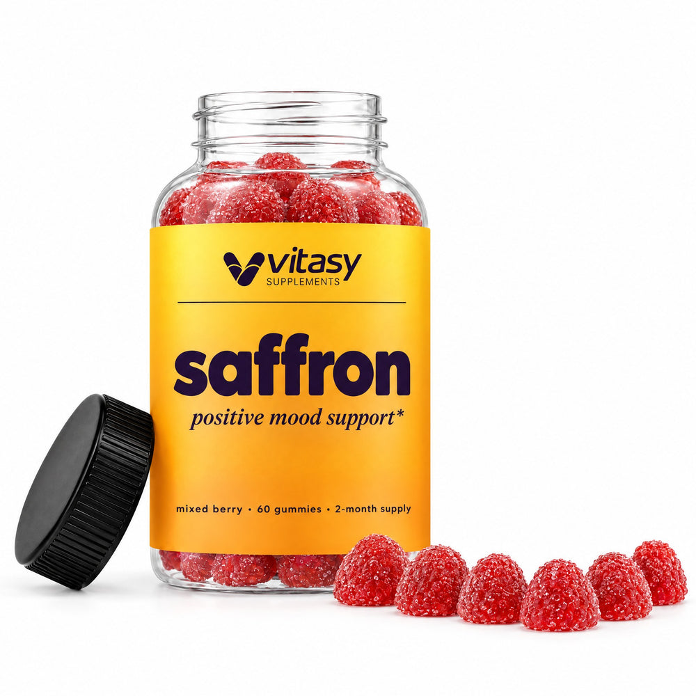 Vitasy Saffron Gummies bottle with its lid off and a row of red gummies