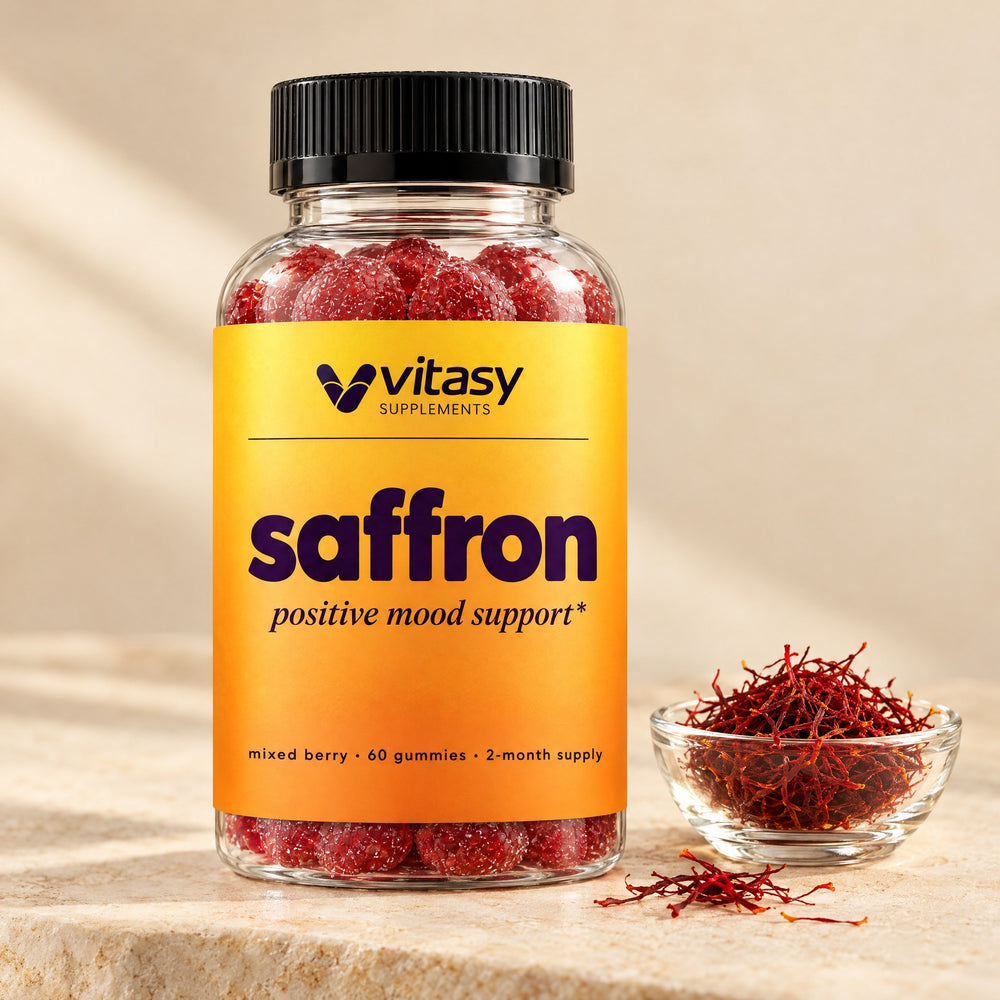Vitasy Saffron Gummies bottle next to a glass dish of saffron threads