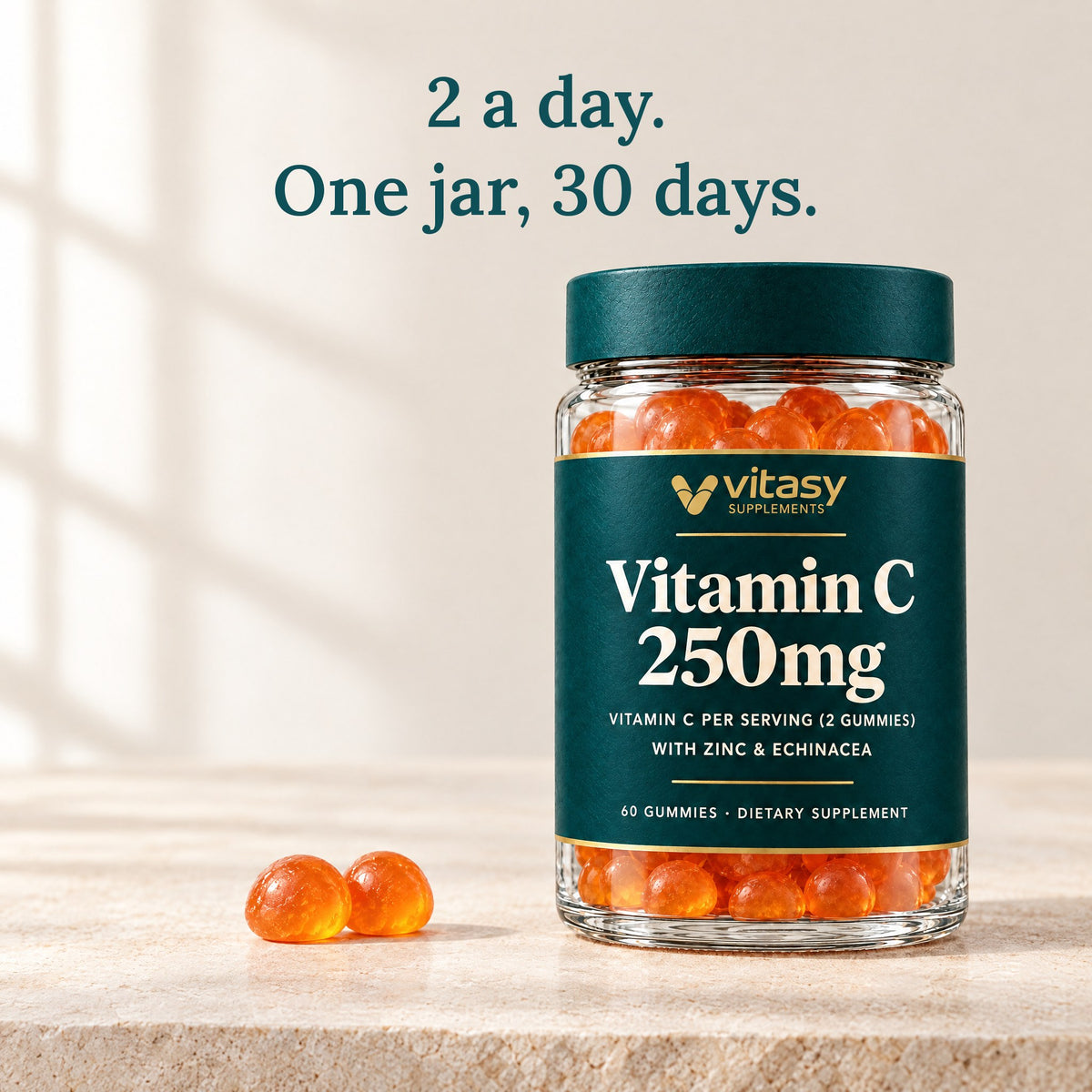 Two orange gummies next to the Vitasy jar: 2 a day, one jar lasts 30 days