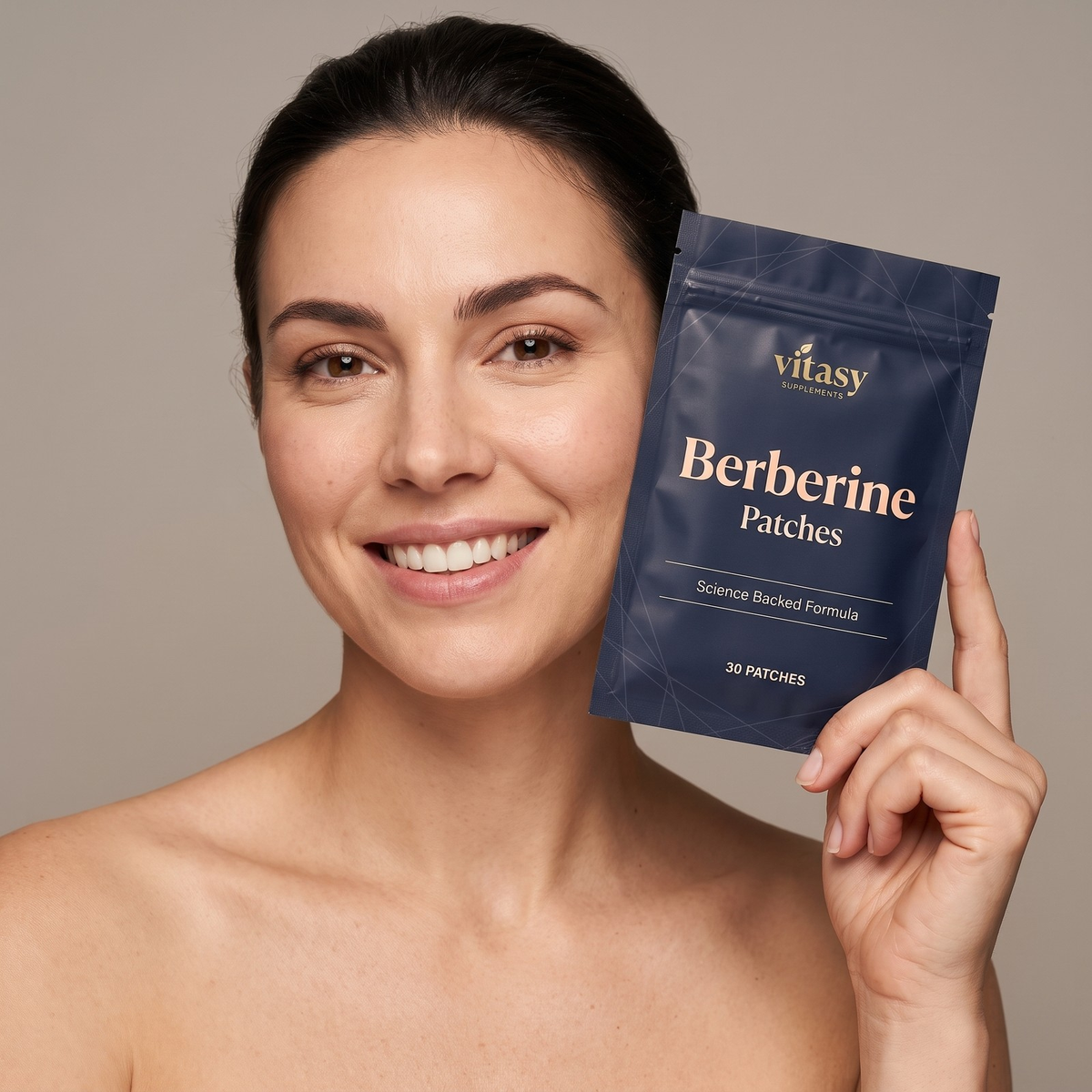 Smiling woman holding a Vitasy Berberine Patches pouch