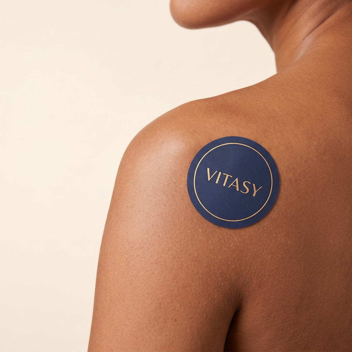 Close-up of a shoulder wearing a Vitasy patch