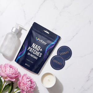 Vitasy NAD+ Patches pouch on a marble vanity