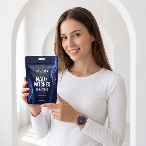Woman in a white top holding a Vitasy pouch