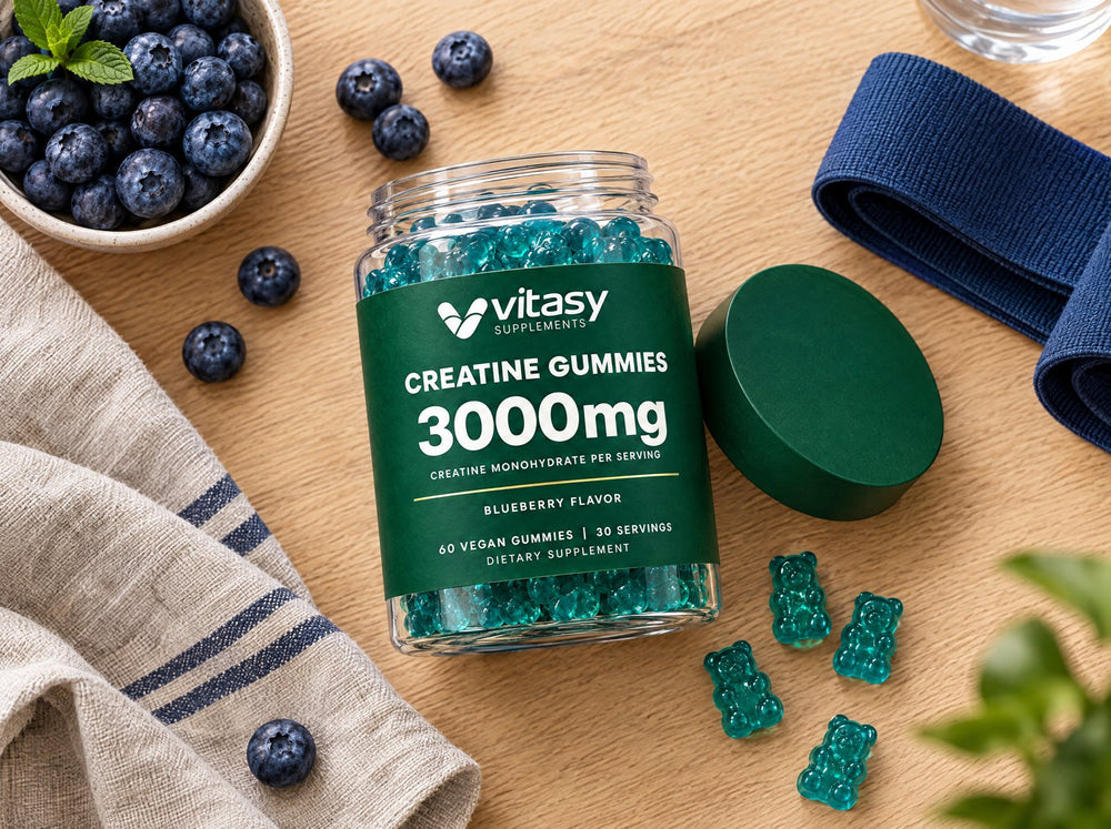 Flat-lay of the creatine jar with gummies, blueberries and a resistance band