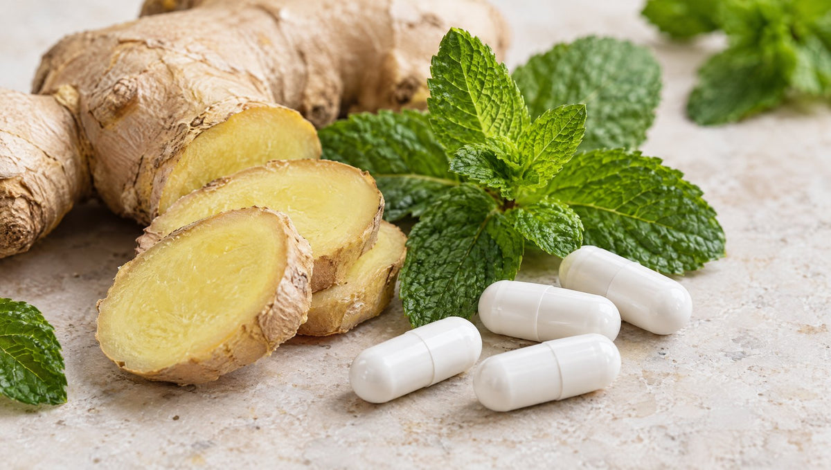 Close-up of ginger, peppermint and white capsules