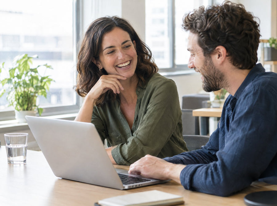 Woman laughing with a colleague in the afternoon