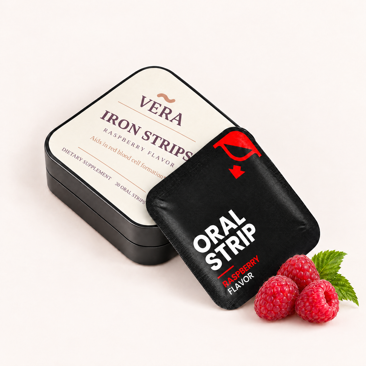 VERA Iron Strips tin and raspberry oral strip pouch with fresh raspberries