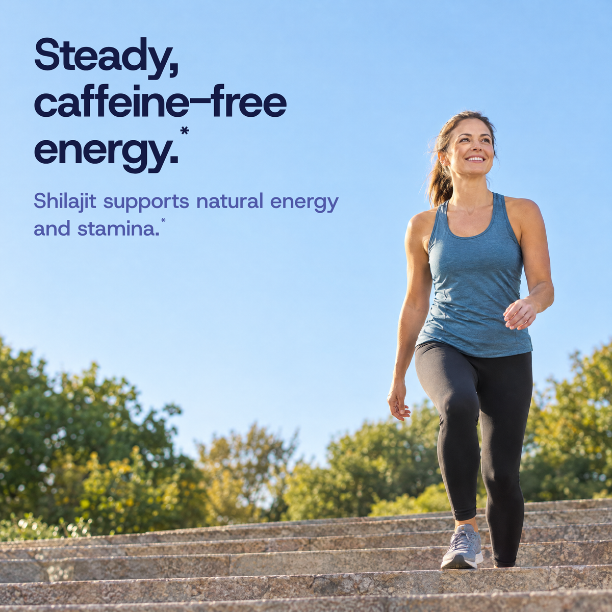 Woman walking up park steps on a sunny afternoon. Steady, caffeine-free energy. Shilajit supports natural energy and stamina.