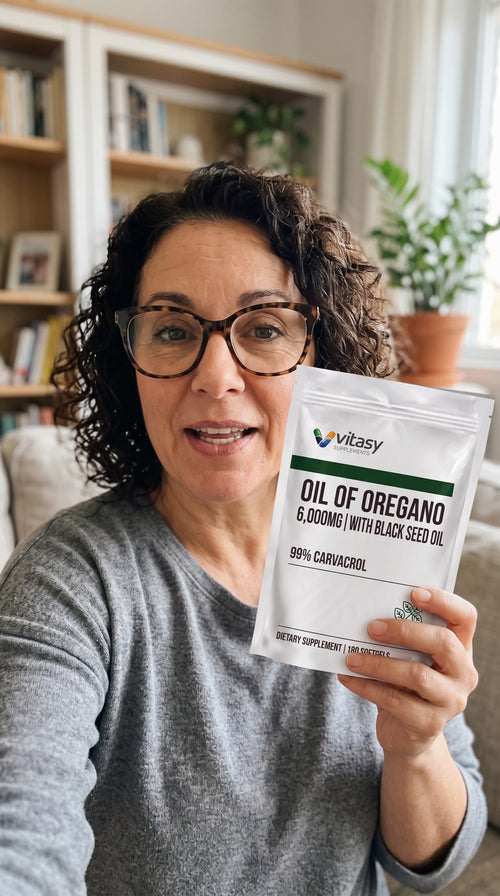 Woman holding a pouch of Vitasy Oil of Oregano at home