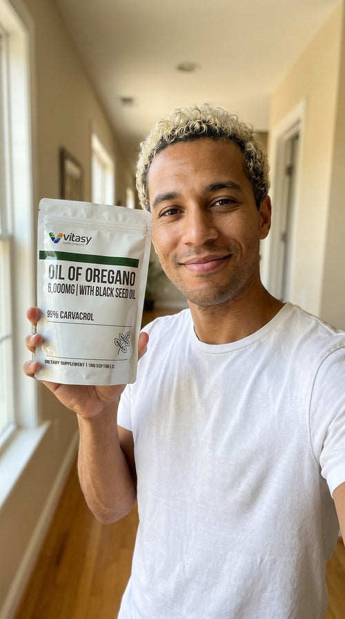 Man holding a pouch of Vitasy Oil of Oregano