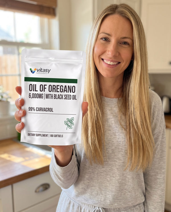 Smiling woman with a pouch of Vitasy Oil of Oregano