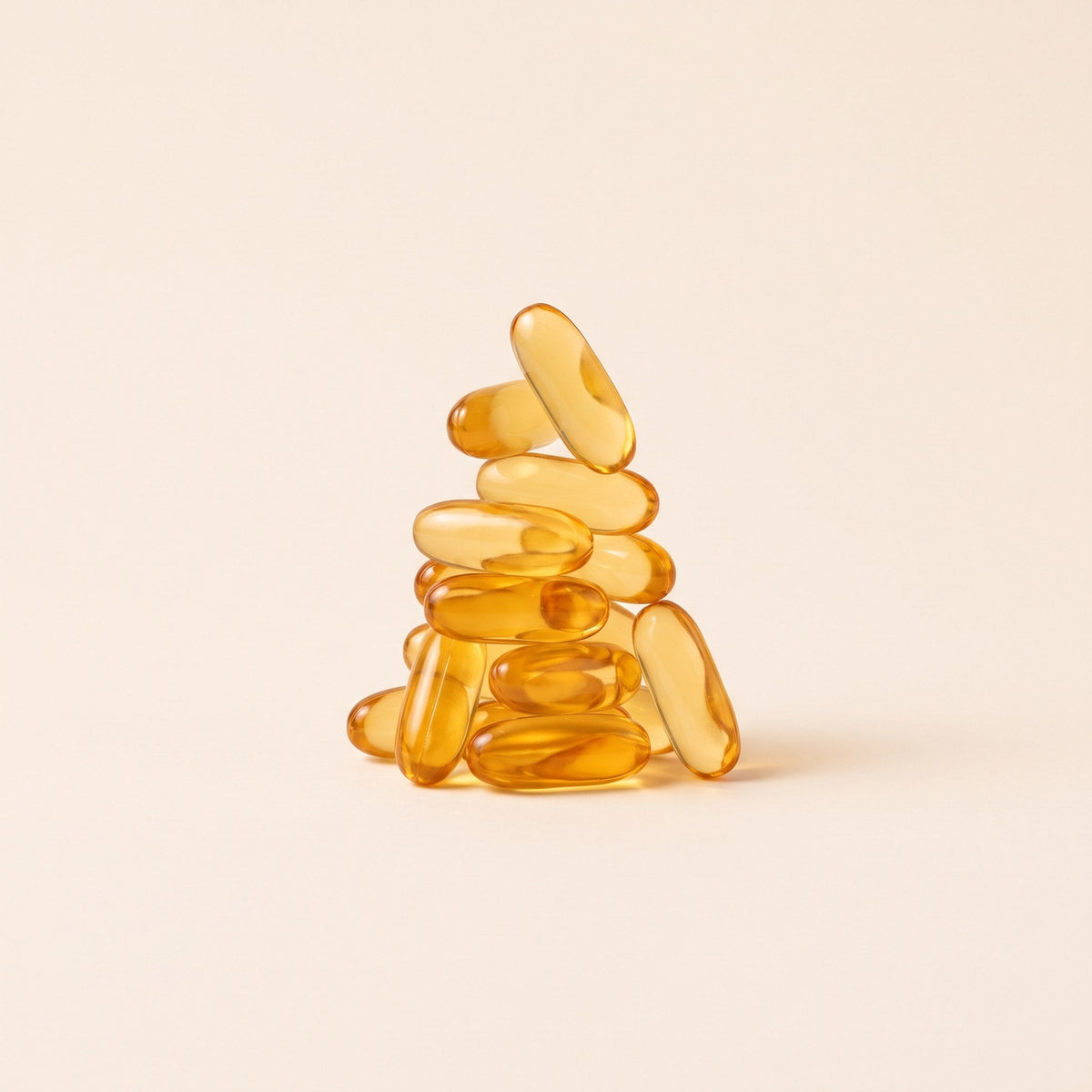 Stack of amber oil of oregano softgels