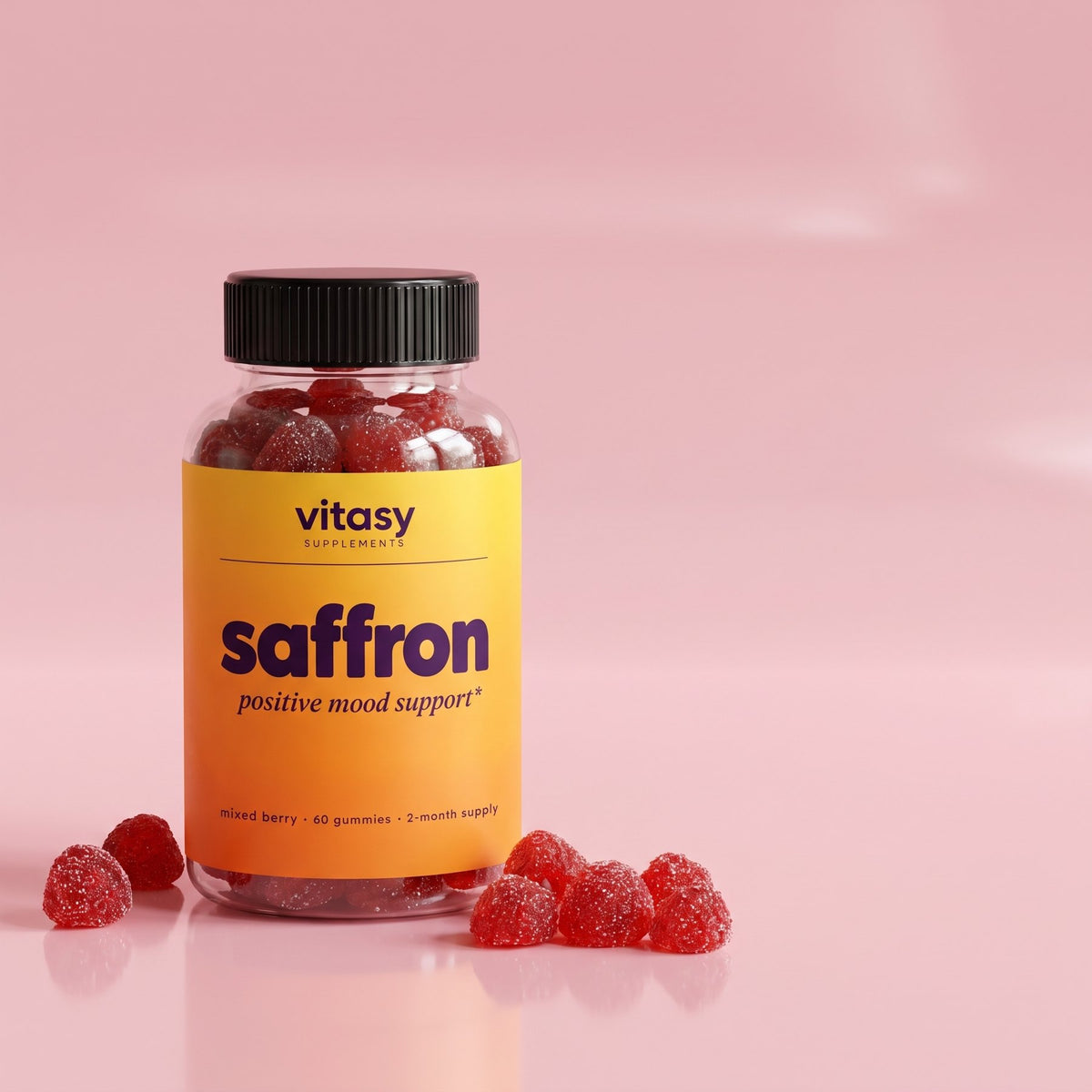 Bottle of Vitasy Saffron Gummies on a soft pink surface