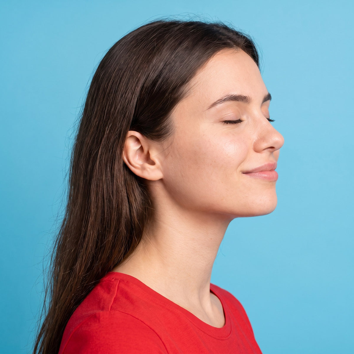Woman with eyes closed enjoying a calm moment