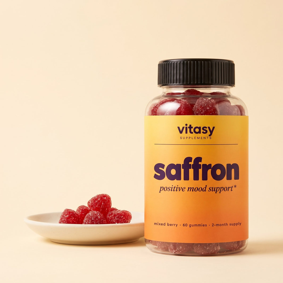 Vitasy Saffron Gummies bottle with loose berry gummies