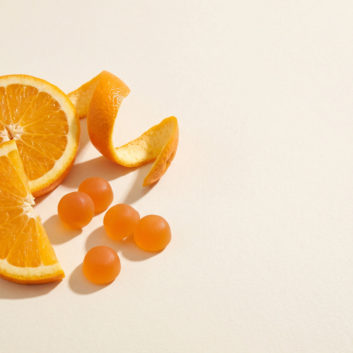 Vitasy Vitamin C Gummies v3 — allergen/standards visual translated to unbadged product/flavor still — Orange
