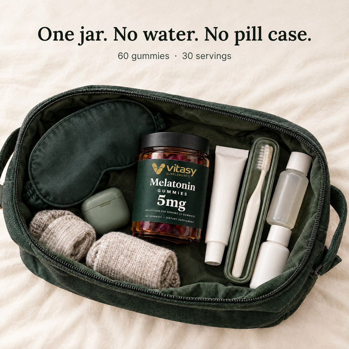 Vitasy Melatonin Gummies jar in an open toiletry bag with a sleep mask and travel items: one jar, no water, no pill case