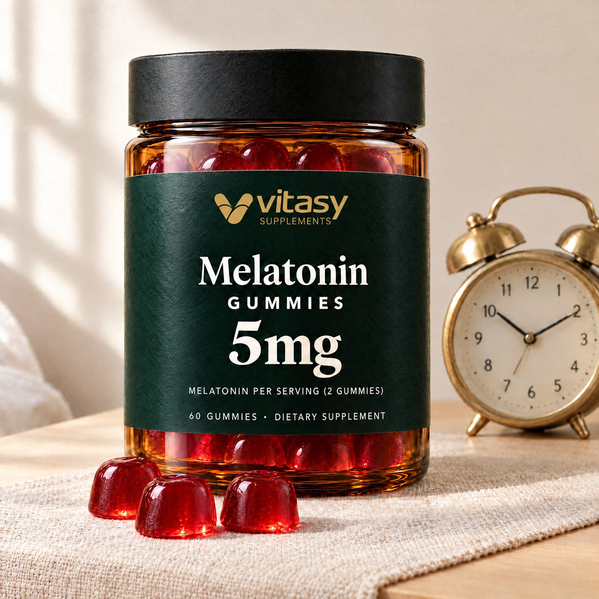 Vitasy Melatonin Gummies jar with cherry gummies next to a brass alarm clock