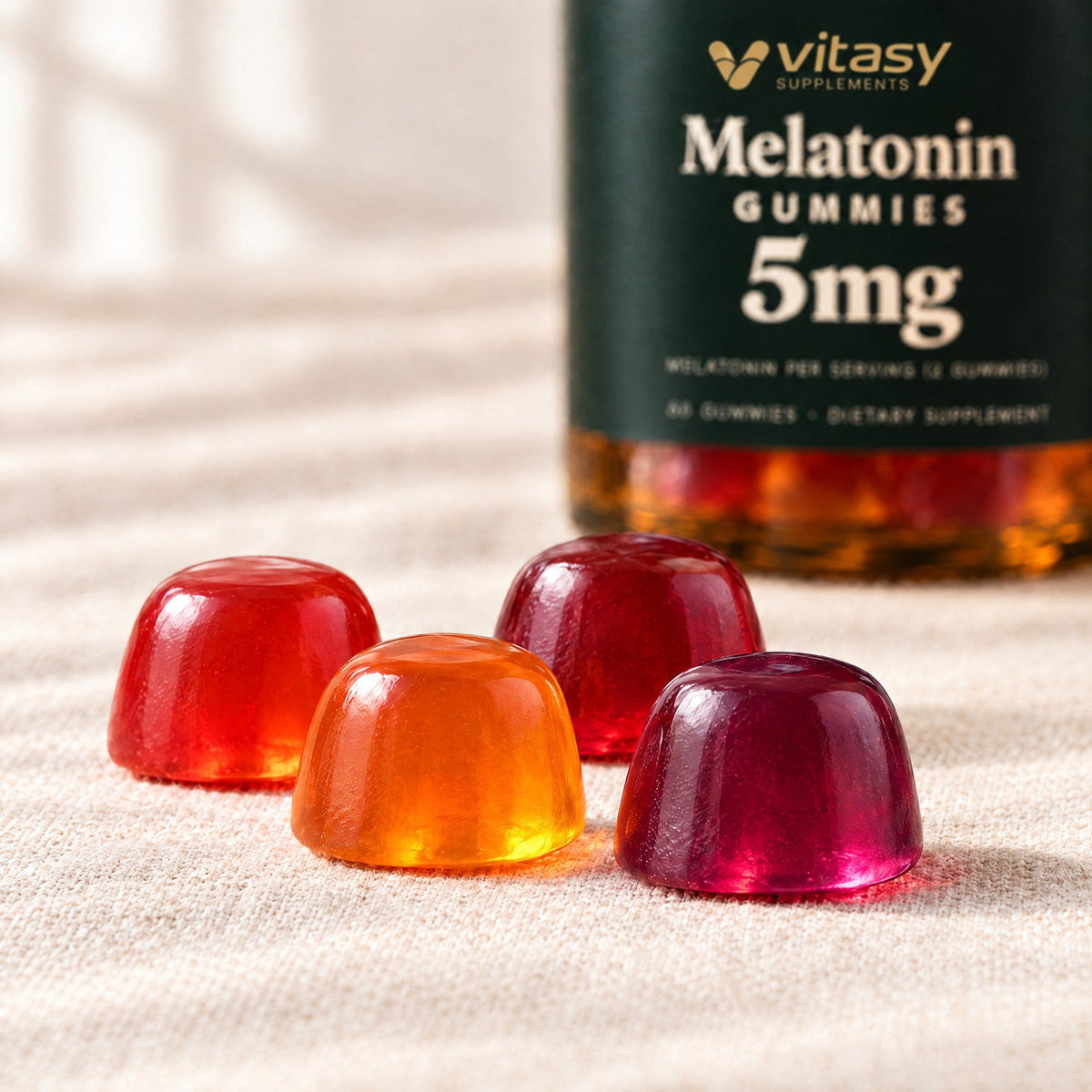 Close-up of strawberry, orange, blueberry and cherry melatonin gummies